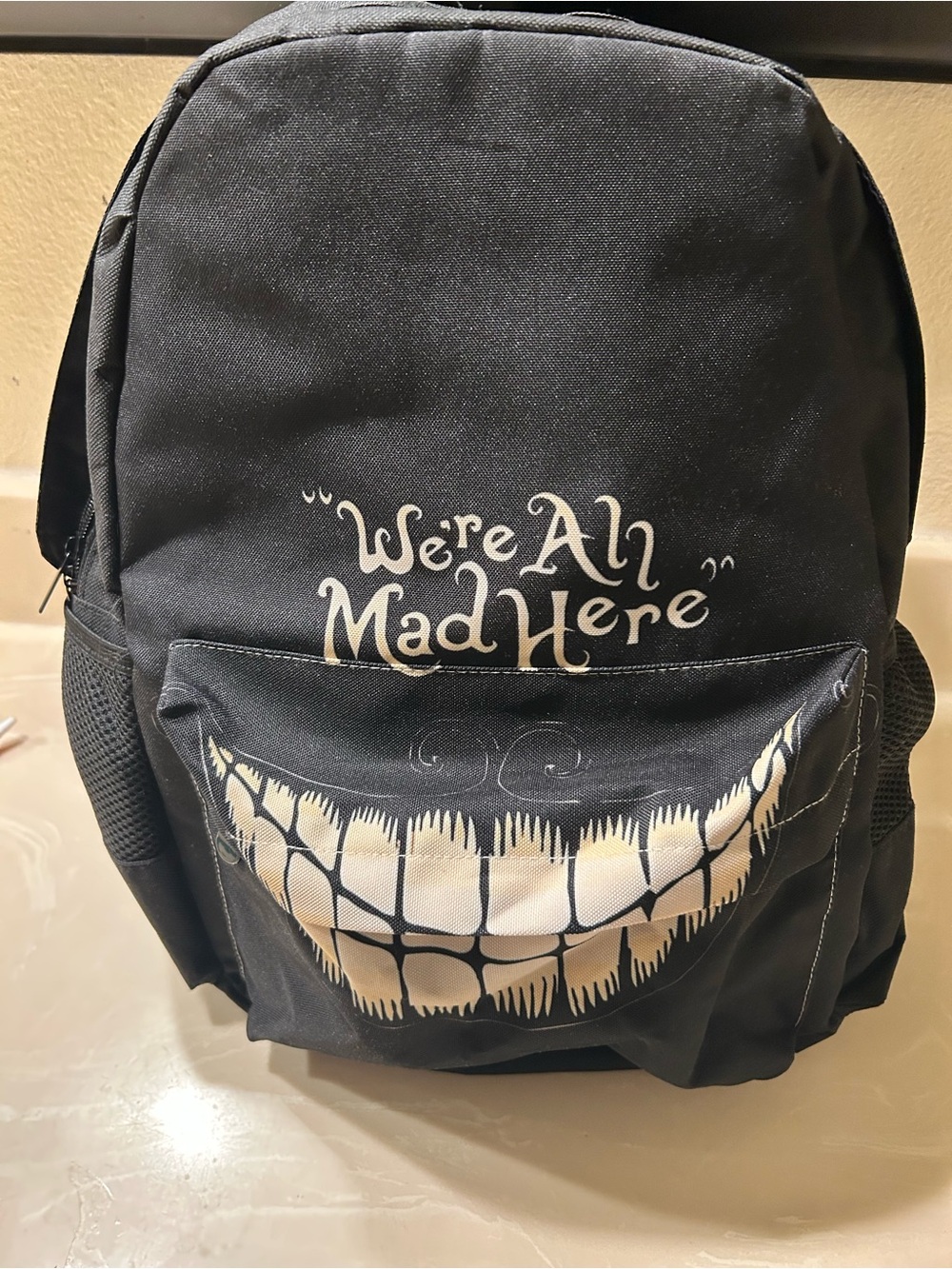 Black "We're All Mad Here" Cheshire Smile Backpack